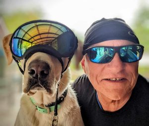 Backroads Bill Steer and his dog wearing goggles