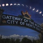 Zack Lewis eclipse composite with Gateway of the North sign City of North Bay